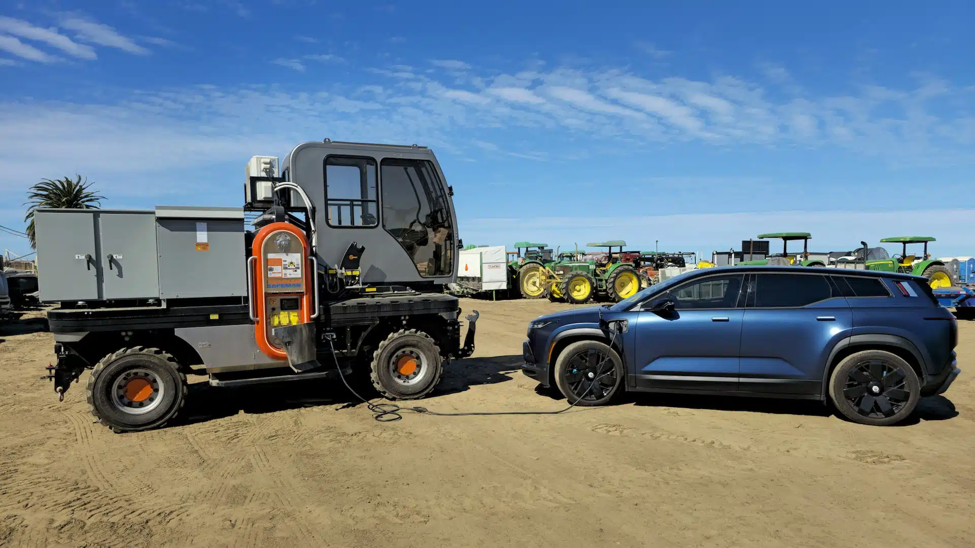DANNAR Export Power 1920x1080 DANNAR Electric work vehicle exporting power to electric vehicle on a job site.